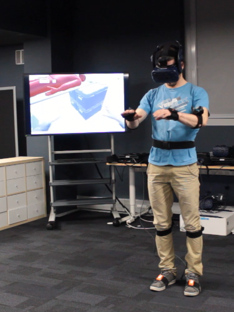 VR user equiped with motion capture devices.